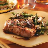 Featured image for Maple-Glazed Pork Chops With Rosemary And Garlic