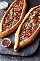 Featured image for Turkish Lamb Pide With Tomatoes, Onions, And Herbs